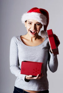 Girl opening a holiday gift