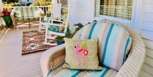 chairs on the porch with decorative pillows at bay haven inn of cape charles